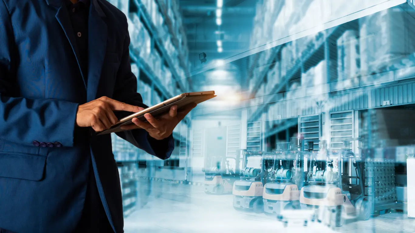 A manager using tablet to check Layered Process Audit Checklist PDFs