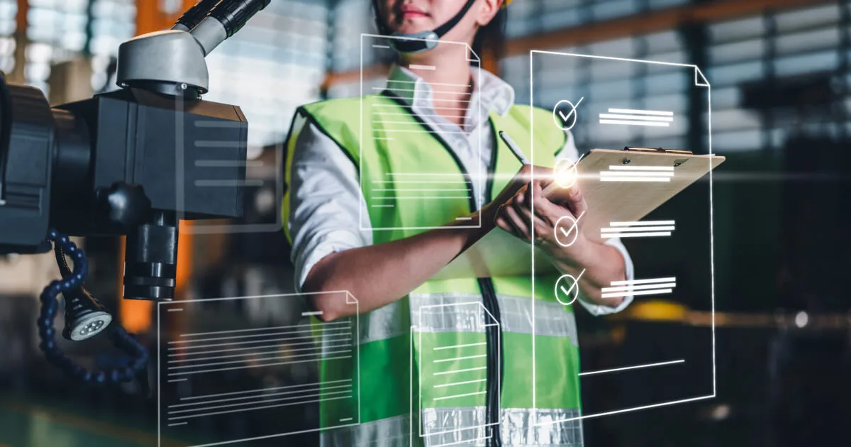 A factory manager checking Quality Control KPIs on his tablet